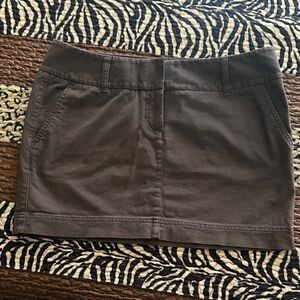 EXPREE, Stylish Brown Mini Skirt with front pockets and mock back pockets.